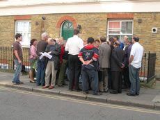 Discussions in front of 107-111 Churchfield Road