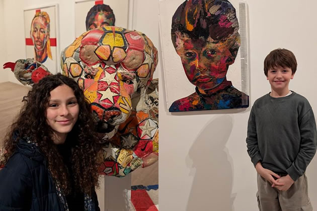 Eleven-year-old Anjelica (left) with a sculpture she helped create and eight-year-old Caspar (right) next to his portrait