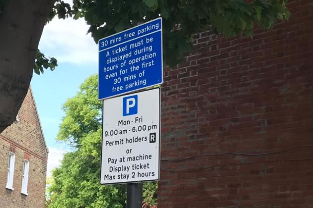 A stop and shop parking sign