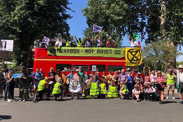 Extinction Rebellion’s climate bus travels across South London with the message ‘Cut Carbon Not Buses’ 