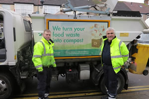 Leader of Merton Council, Councillor Stephen Alambritis helps with waste collection
