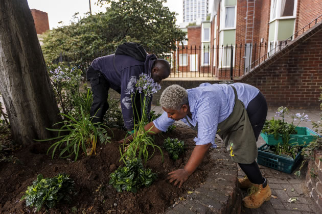 Volunteers from Waste Not Want Not Battersea planting flowers donated by the Foundation