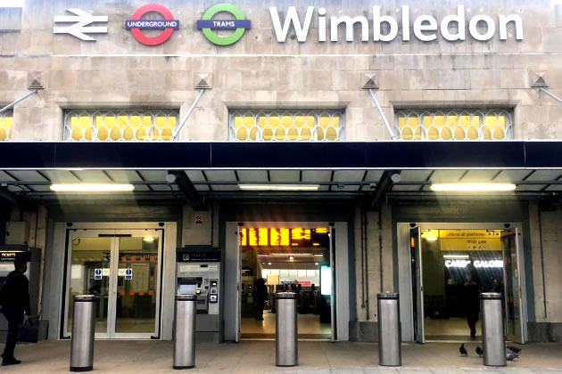 The entrance to Wimbledon Station with new tram sign